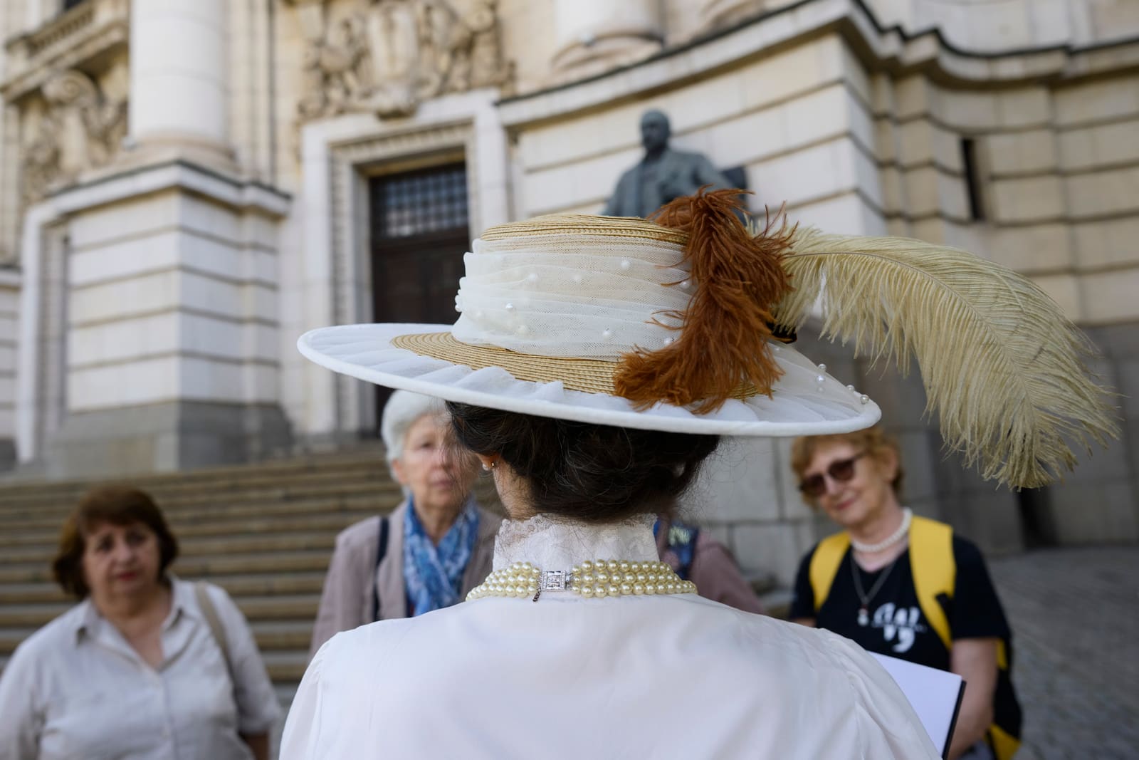 Guests listening at the University steps